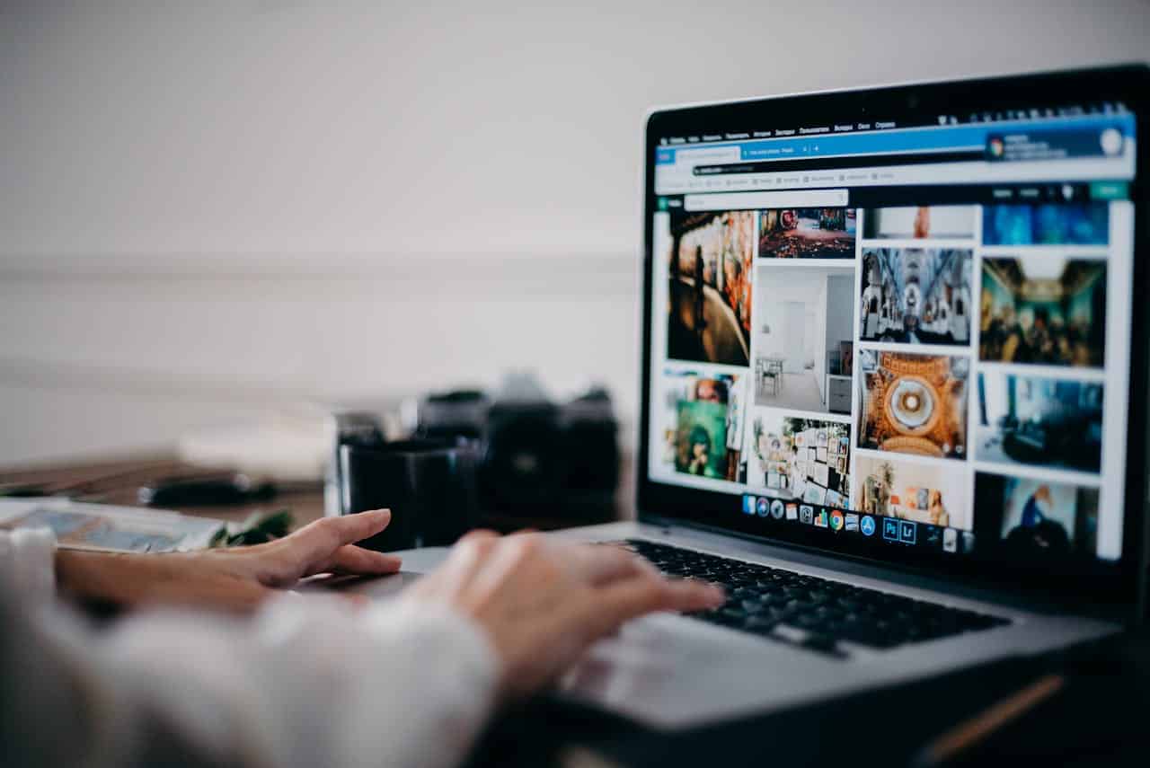 Person researching online marketing strategies for a landscaping business.